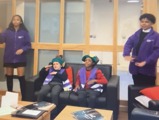 KS3 and Primary Students singing we wish you a merry christmas in Makaton